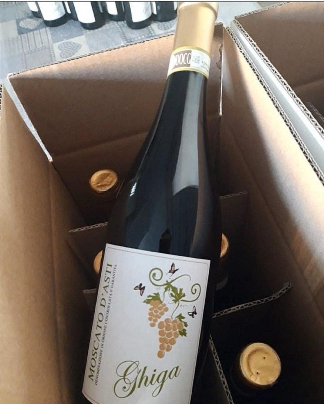 A Ghiga bottle lifted from an open shipping case